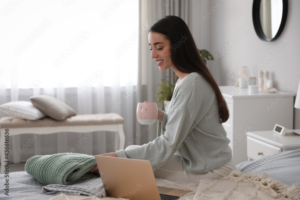 Young woman choosing clothes for work day at home. Morning routine Young woman choosing clothes for work day at home. Morning routine