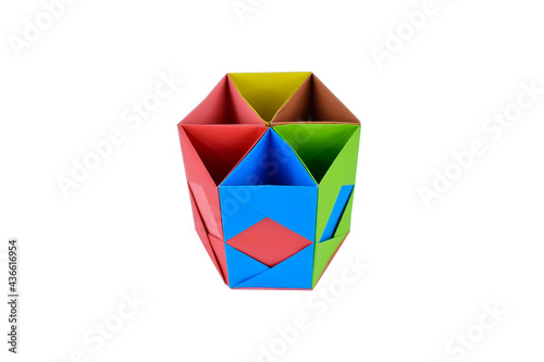Top view of hand-made paper box placed on top of a white isolated paper background