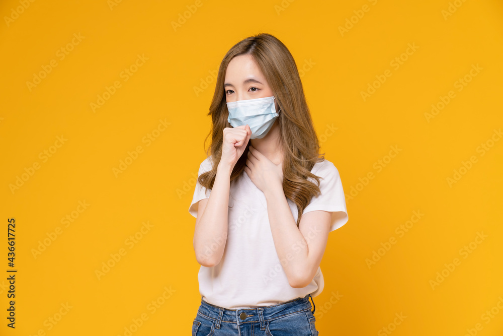 Asian woman wear masks to protect disease on yellow background.