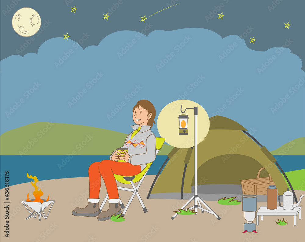 Fototapeta premium 夜、湖畔でソロキャンプを楽しむ女性