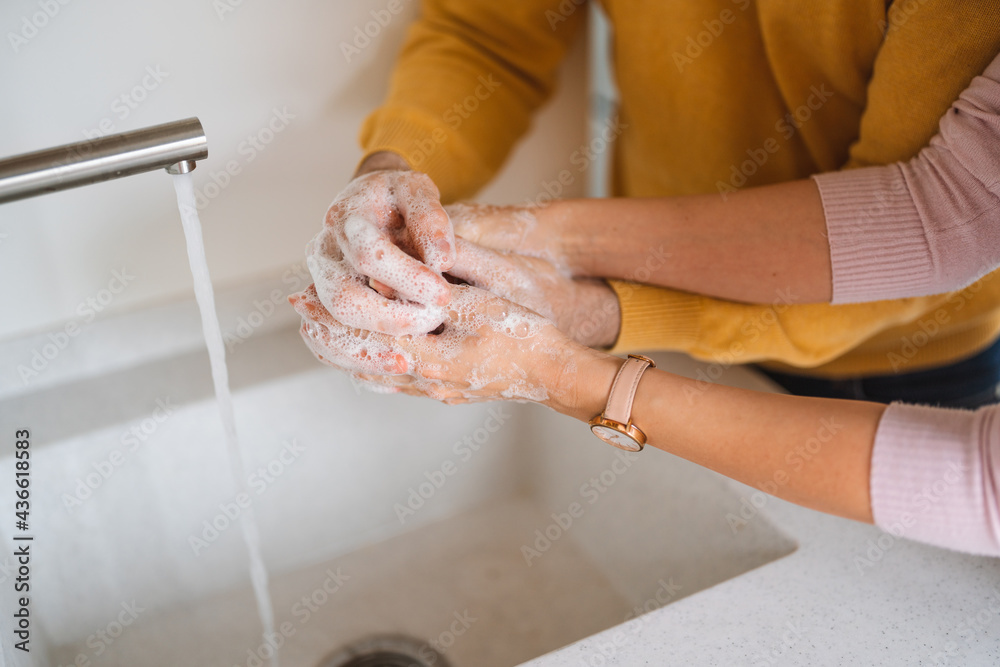 Washing hands with alcohol gel or antibacterial soap sanitizer. Hygiene concept