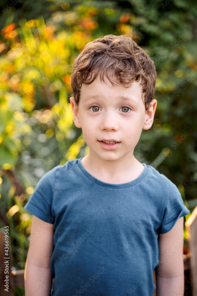 a boy in flowers, a child among the bushes a boy in flowers, a child among the bushes