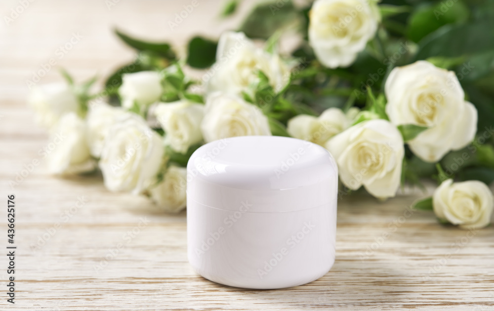 Moisturizing cosmetics, luxury natural face or body cream in a jar on a wooden table, copy space for text.