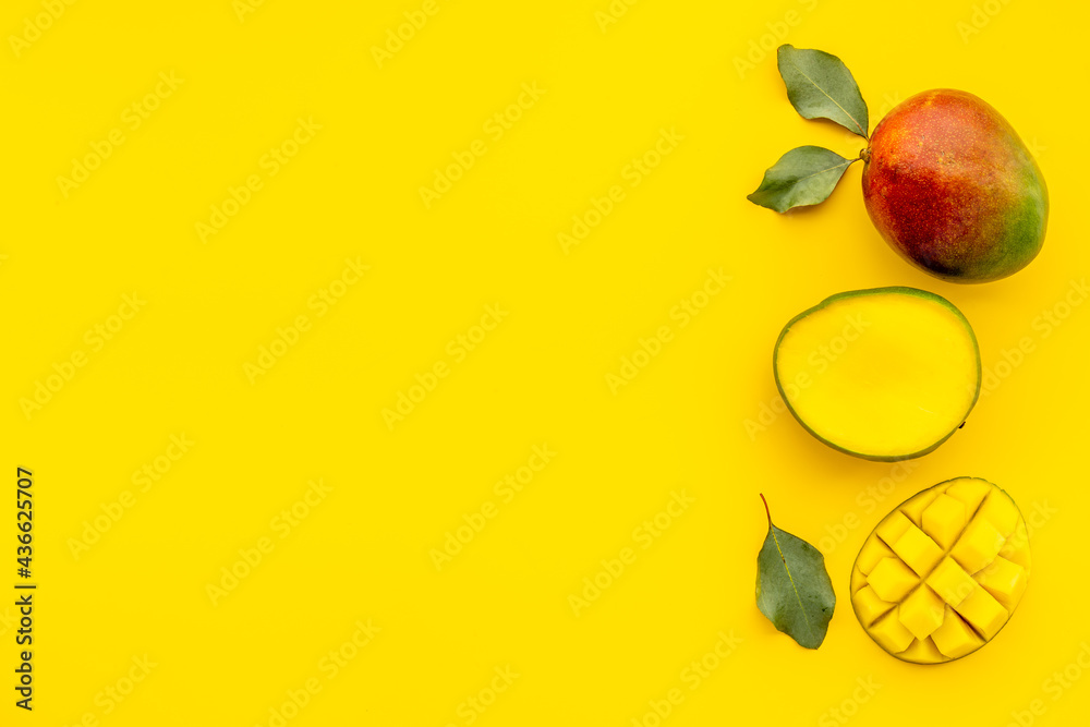 Mango fruit slices and cubes. Tropical fruits layout Mango fruit slices and cubes. Tropical fruits layout