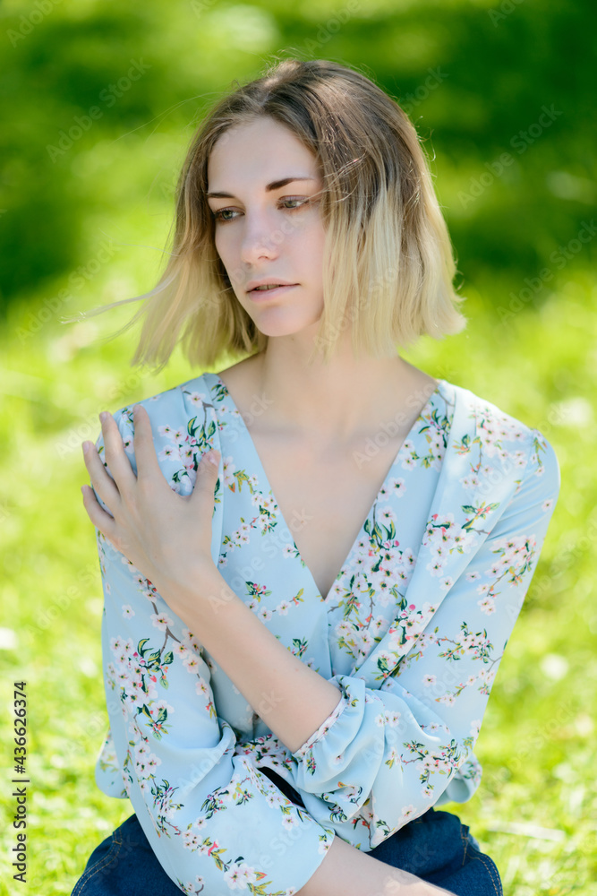 Outdoors portrait of beautiful young woman with green eyes. Outdoors portrait of beautiful young woman with green eyes.