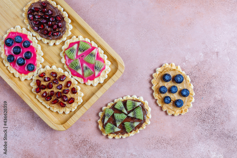 Homemade desserts with blueberries,kiwi slices and pomegranate seeds. Homemade desserts with blueberries,kiwi slices and pomegranate seeds.