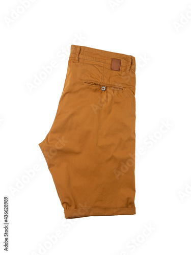Short men's shorts folded up on a white isolated background. Hot weather clothing. Clothing shopping theme. Top view.