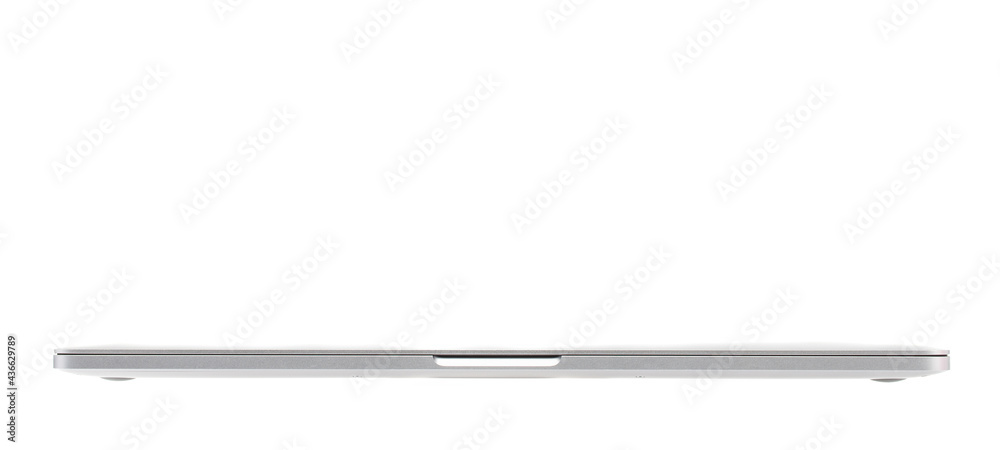 Close and flat silver luxury notebook computer posses sideway, is in isolated background Close and flat silver luxury notebook computer posses sideway, is in isolated background