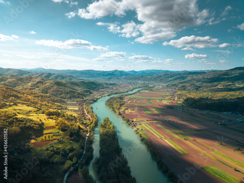 Colorful agricultural fields alongside Drina river photo