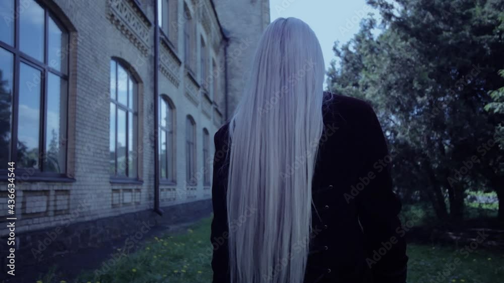 The horrible woman vampire pulls the hand. She wants to scare. The horrible woman vampire pulls the hand. She wants to scare.
