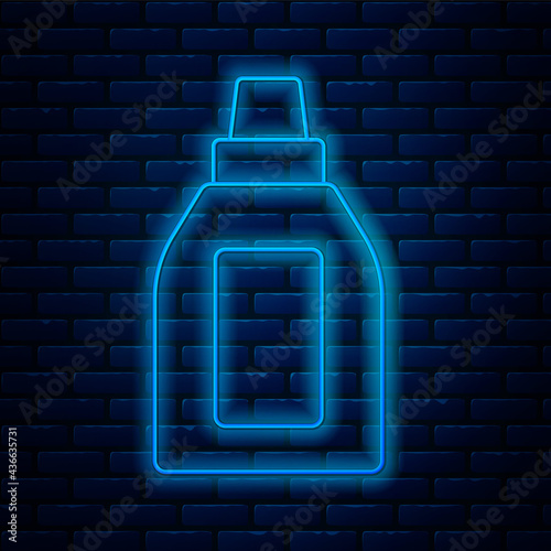 Glowing neon line Plastic bottle for laundry detergent, bleach, dishwashing liquid or another cleaning agent icon isolated on brick wall background. Vector