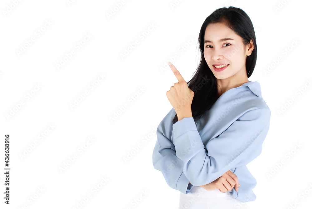 Close-up portrait of pretty woman wearing casual light grey clothes, pointing index finger up to copy space and happy expression by smiling wide opened mouth. Advertising concept. Close-up portrait of pretty woman wearing casual light grey clothes, pointing index finger up to copy space and happy expression by smiling wide opened mouth. Advertising concept.