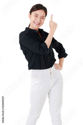 Asian business cheerful woman wearing casual black shirt, happily smiling, pointing and presenting hand for advertisement, looking at camera blank copy space with isolated white background cutout.