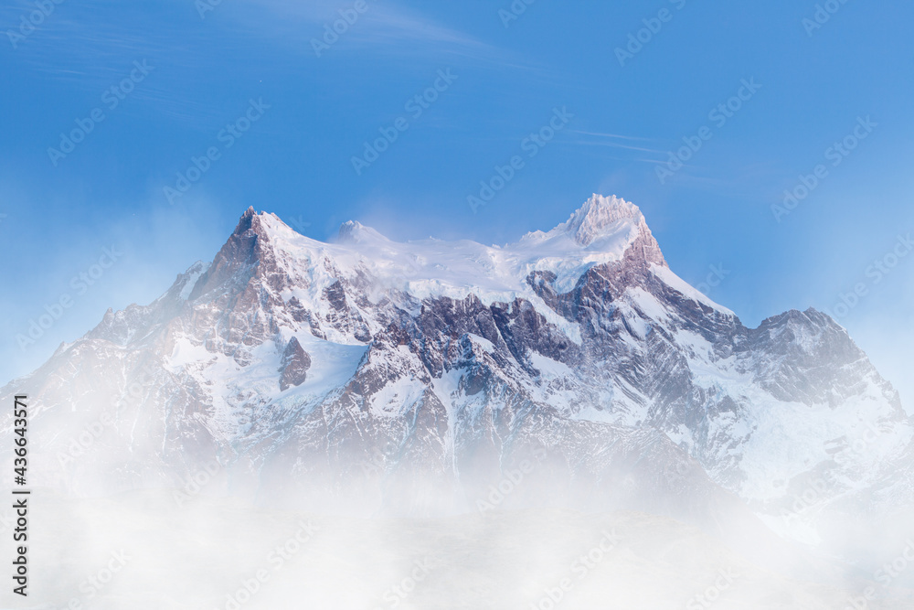 Obraz premium The snow and glacier covered summit of Cerro Paine Grande in Torres del Paine National Park, Patagonia, South Chile