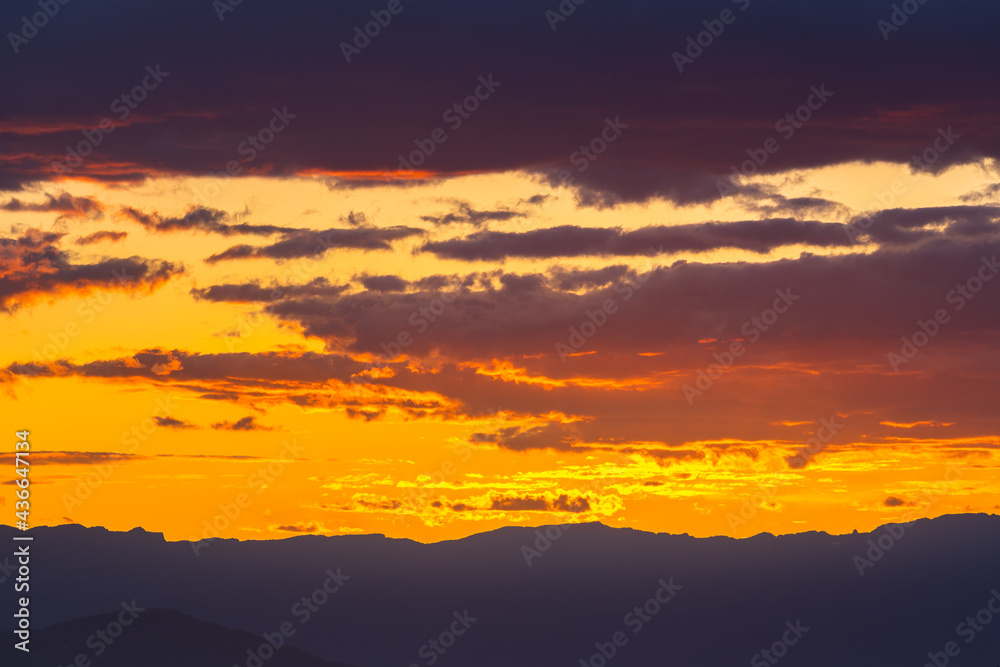 Beautiful sunset-sunrise sky with orange clouds. Golden hour