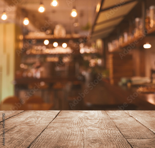 Empty wooden table in cafe. Bokeh effect © New Africa