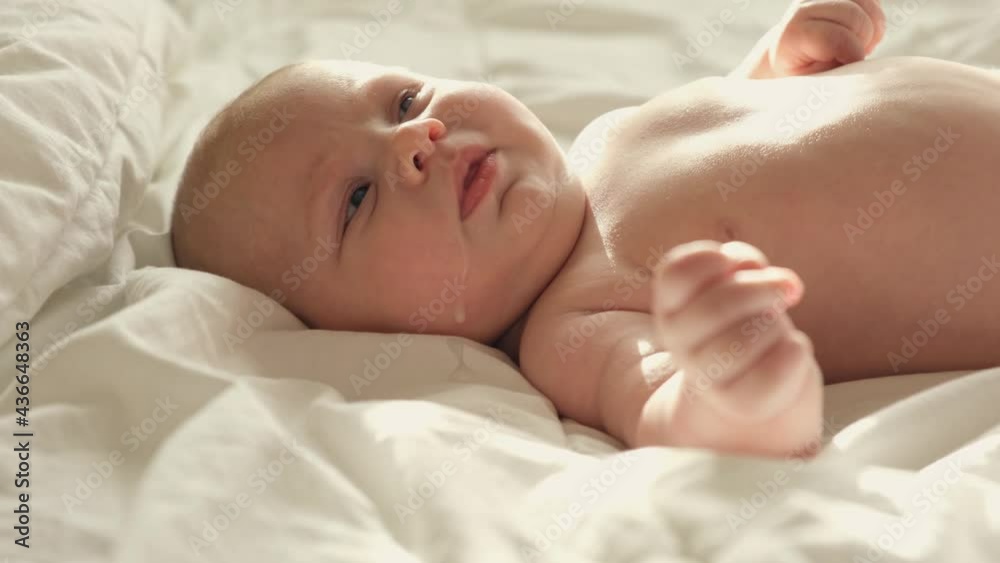 Baby regurgitates breast milk. Little baby crying and mother cleaning her cute face. Authentic Close Up Footage of Adorable Newborn Baby. Concept of Childhood, New Llife, Breast Feeding, Parenthood. Baby regurgitates breast milk. Little baby crying and mother cleaning her cute face. Authentic Close Up Footage of Adorable Newborn Baby. Concept of Childhood, New Llife, Breast Feeding, Parenthood.