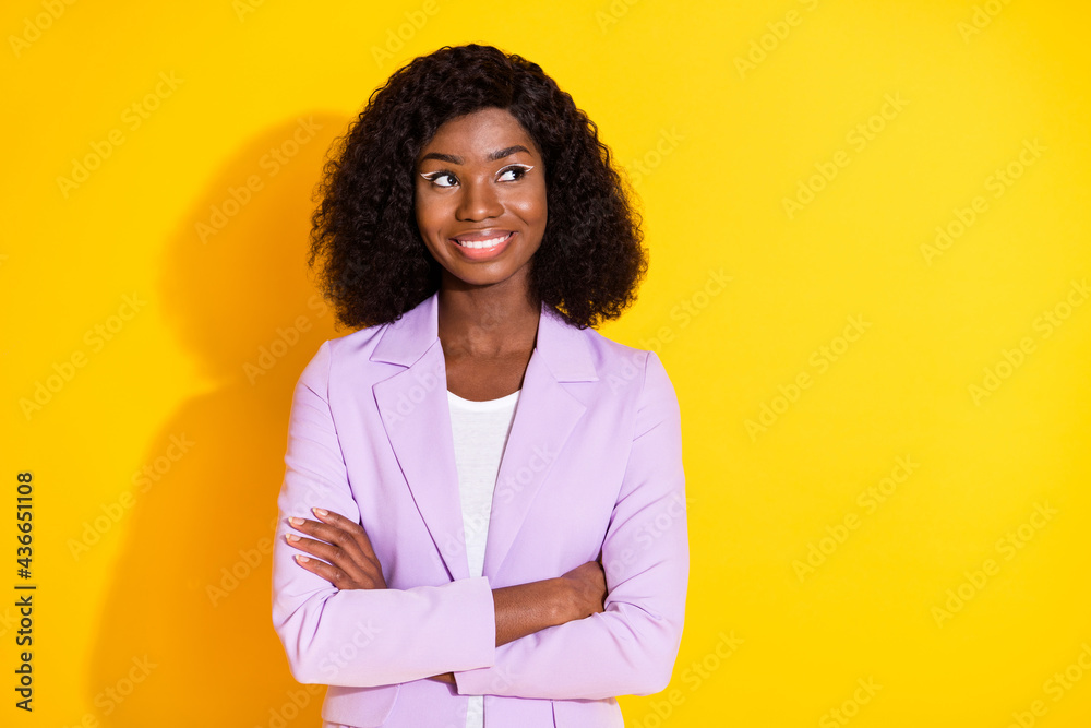 Photo of young happy smiling lovely afro businesswoman look copyspace with folded hands isolated on yellow color background