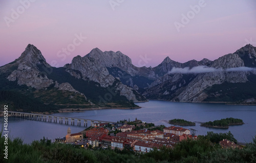 Scenic view of a mountainous landscape and a river in Riano, Leon Spain during sunset photo