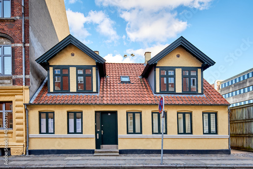 old yellow building in a narrow street in denmark