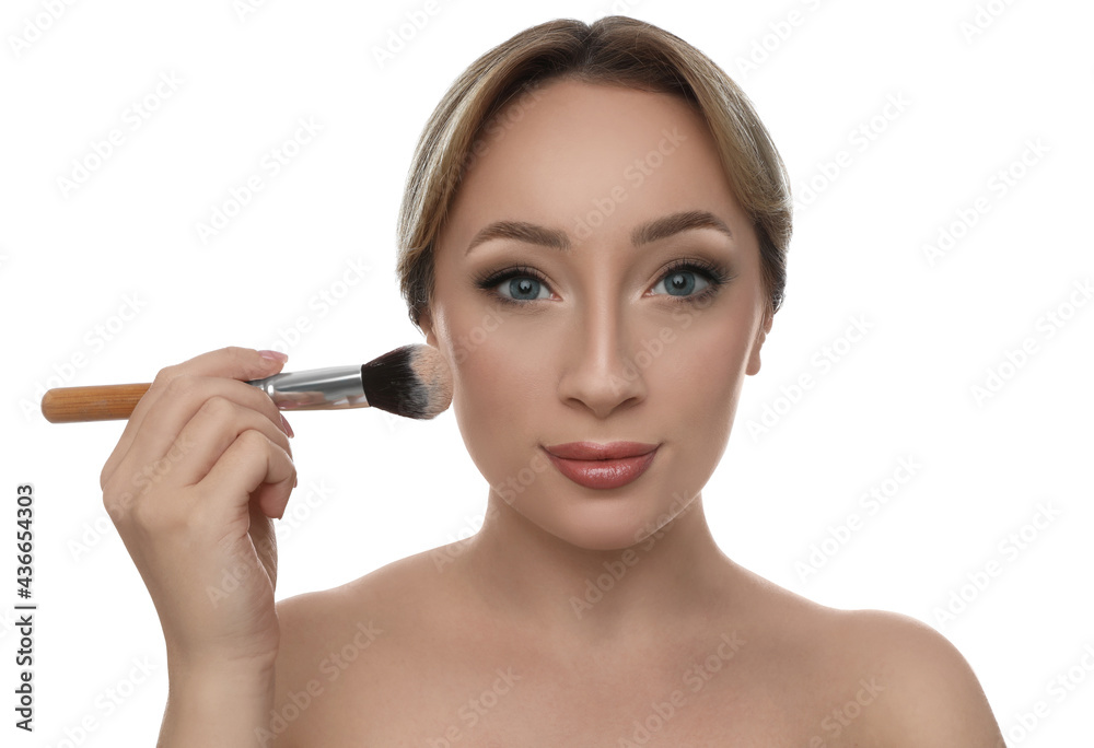 Beautiful young woman applying face powder with brush on white background Beautiful young woman applying face powder with brush on white background