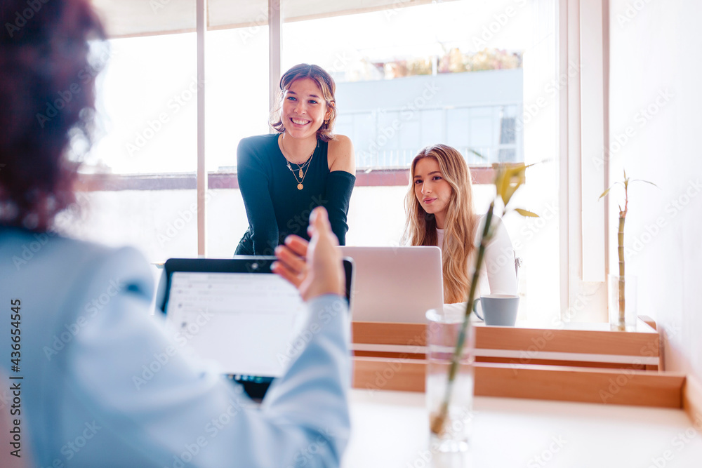 Obraz premium Three women working at the office