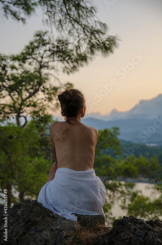 naked person meditating on the beach © Aleksandr