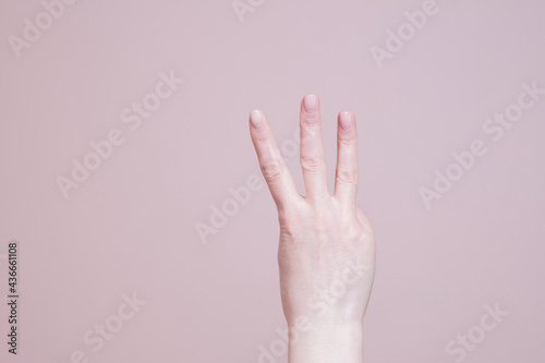 hand showing three fingers