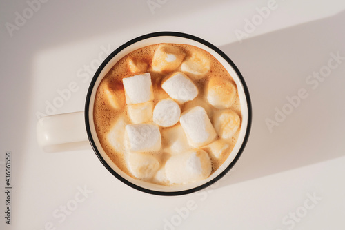 glass of coffee with marshmallow and milk
