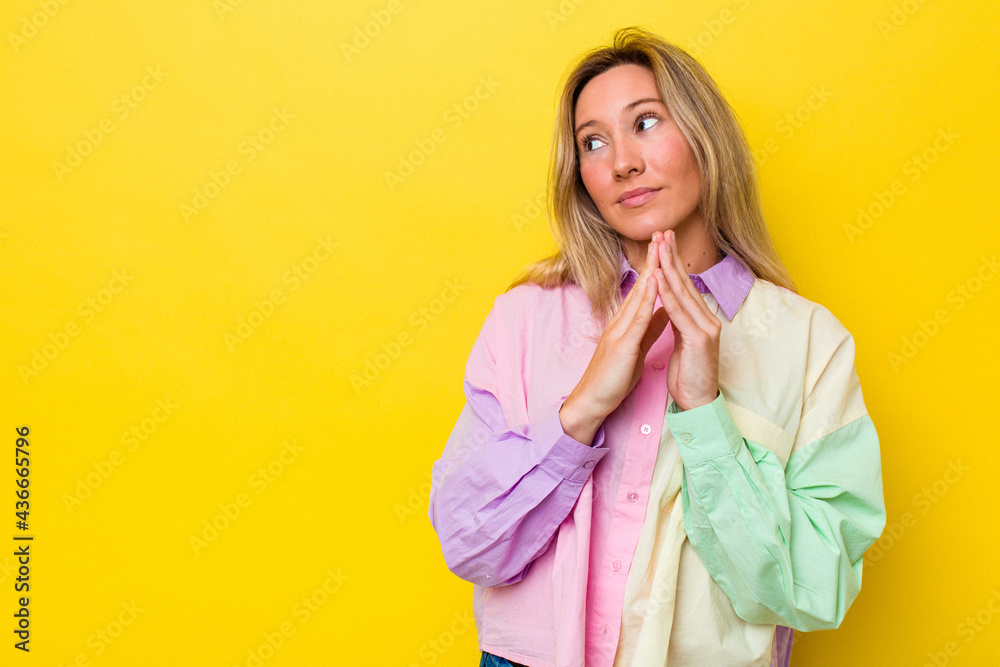 Young australian woman isolated making up plan in mind, setting up an idea. Young australian woman isolated making up plan in mind, setting up an idea.