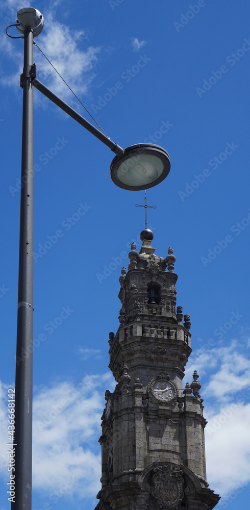 The street lamp seems to cover the church in a visual illusion created by the lines, In Porto, Portugal