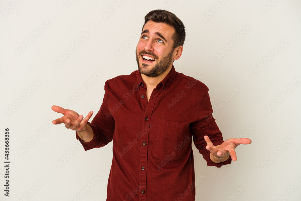 Young caucasian man isolated on white background joyful laughing a lot. Happiness concept. Young caucasian man isolated on white background joyful laughing a lot. Happiness concept.
