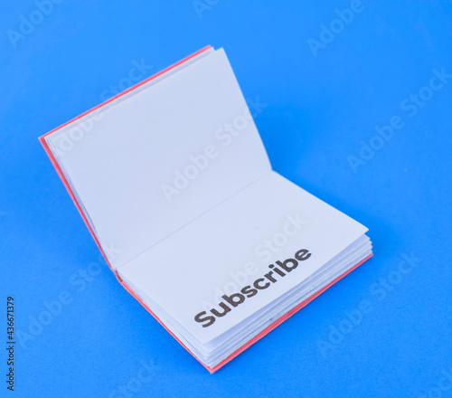 Book made with small craft paper and nicely placed on a paper background
