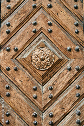 wooden door with metal rivets