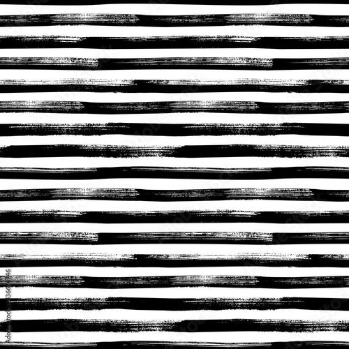 Grunge bold lines vector seamless pattern. Horizontal brush strokes, straight stripes or lines. Black ink striped hand drawn background. Geometric ornament for wrapping paper. Dry brushstrokes pattern photo