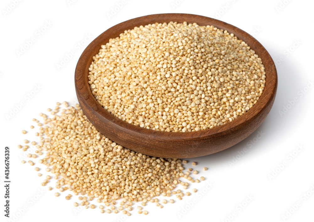 raw white quinoa in the wooden bowl, isolated on white background raw white quinoa in the wooden bowl, isolated on white background