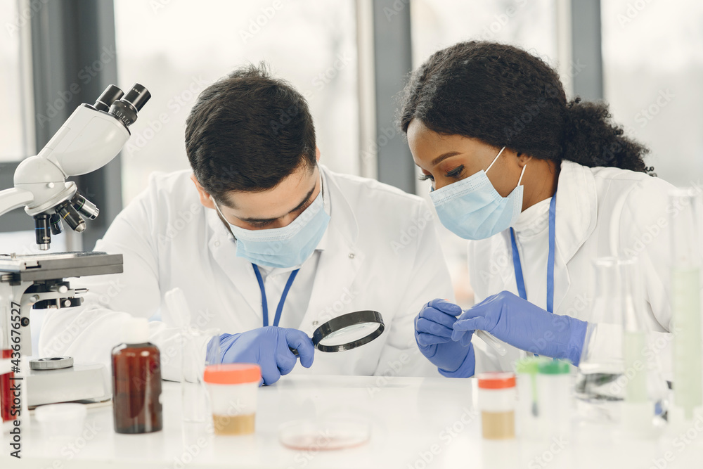 Researchers creating vaccine for covid-19 in a lab Researchers creating vaccine for covid-19 in a lab