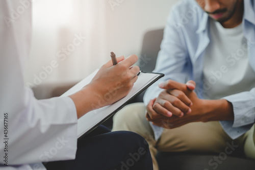 Men talk with a psychologist during talking therapy stressed mental health at office photo