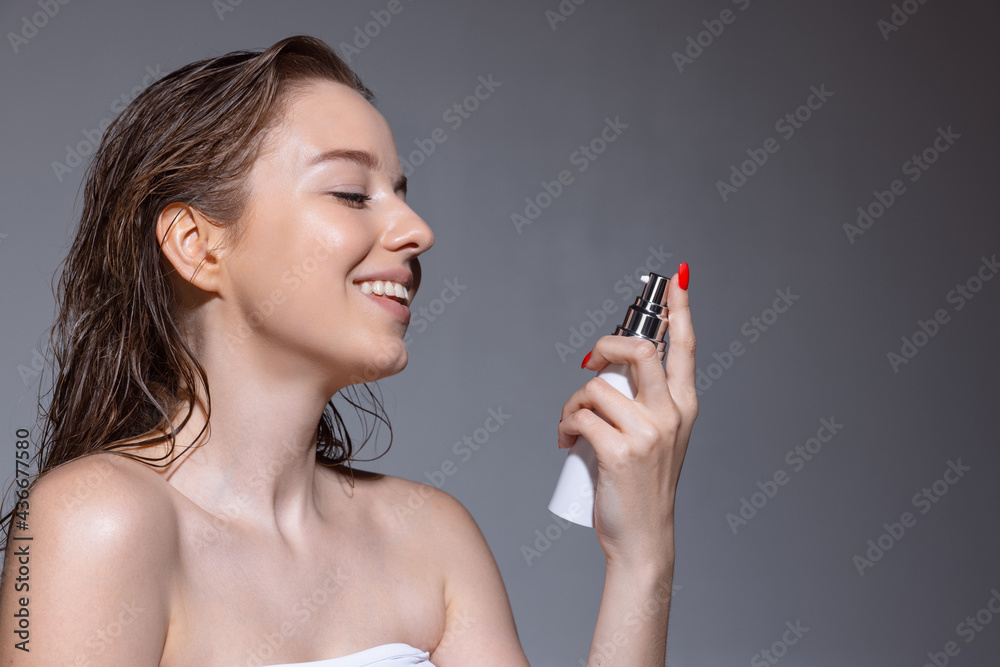 Portrait of young female fashion model isolated on grey studio background. Beautiful caucasian woman with well-kept skin. Portrait of young female fashion model isolated on grey studio background. Beautiful caucasian woman with well-kept skin.