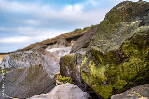 Close up of rocks used to protect the Norfolk coastline with selective focus, shallow depth of field and bokeh