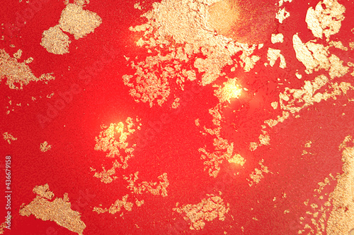 Yellow, ruby red and gold abstract background. Alcohol ink marble texture with glitter. Template pattern for banner, poster design. Fluid art painting