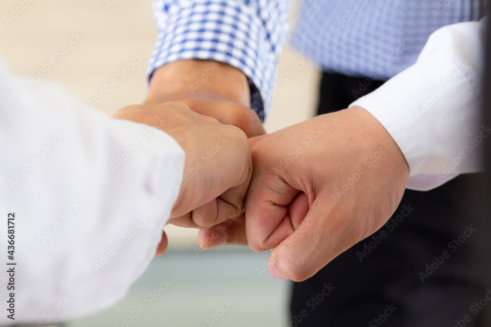 Close up Business Team or Partners making pile of hands at project meeting. Team work Join Hands. Success, Together and Power Team concept. Close up Business Team or Partners making pile of hands at project meeting. Team work Join Hands. Success, Together and Power Team concept.