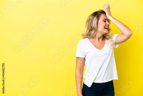 Young Brazilian woman isolated on yellow background has realized something and intending the solution