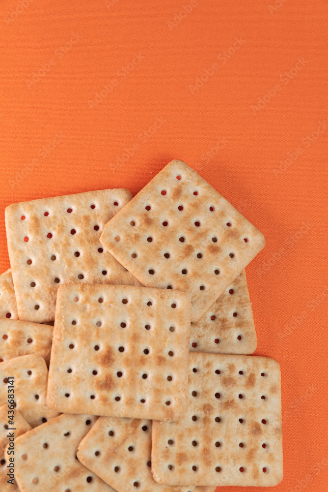Salt crackers on the orange background