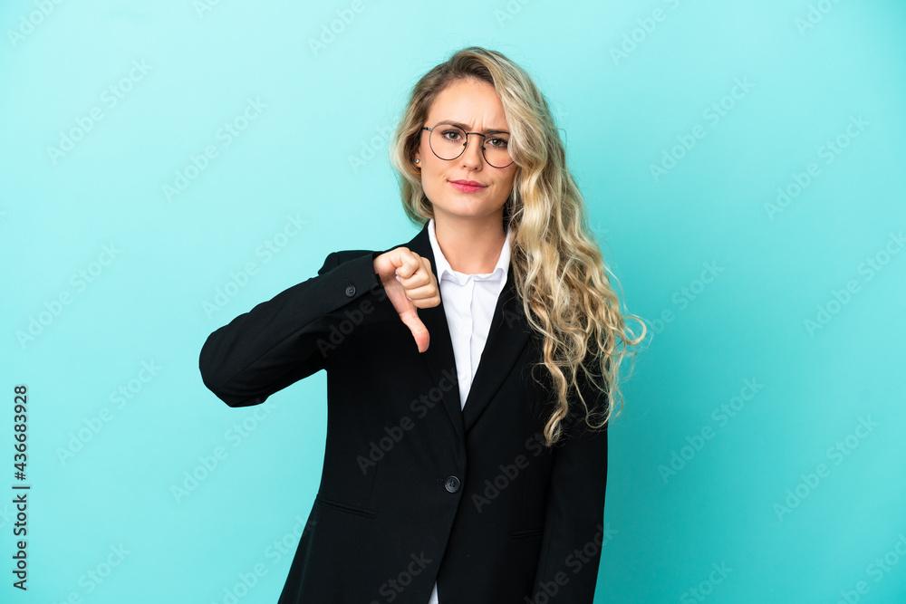 Brazilian business woman over isolated background showing thumb down with negative expression Brazilian business woman over isolated background showing thumb down with negative expression