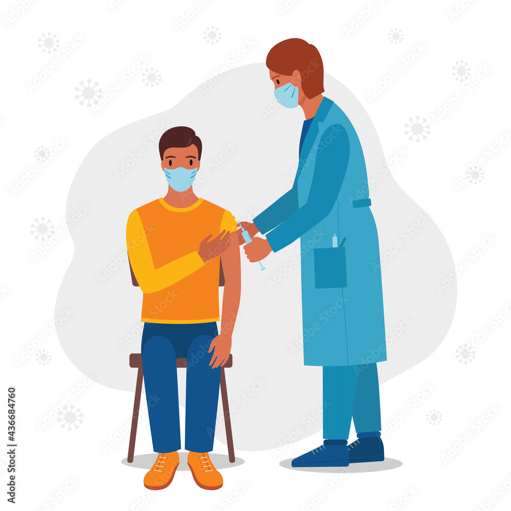 Doctor giving vaccination to male patient.