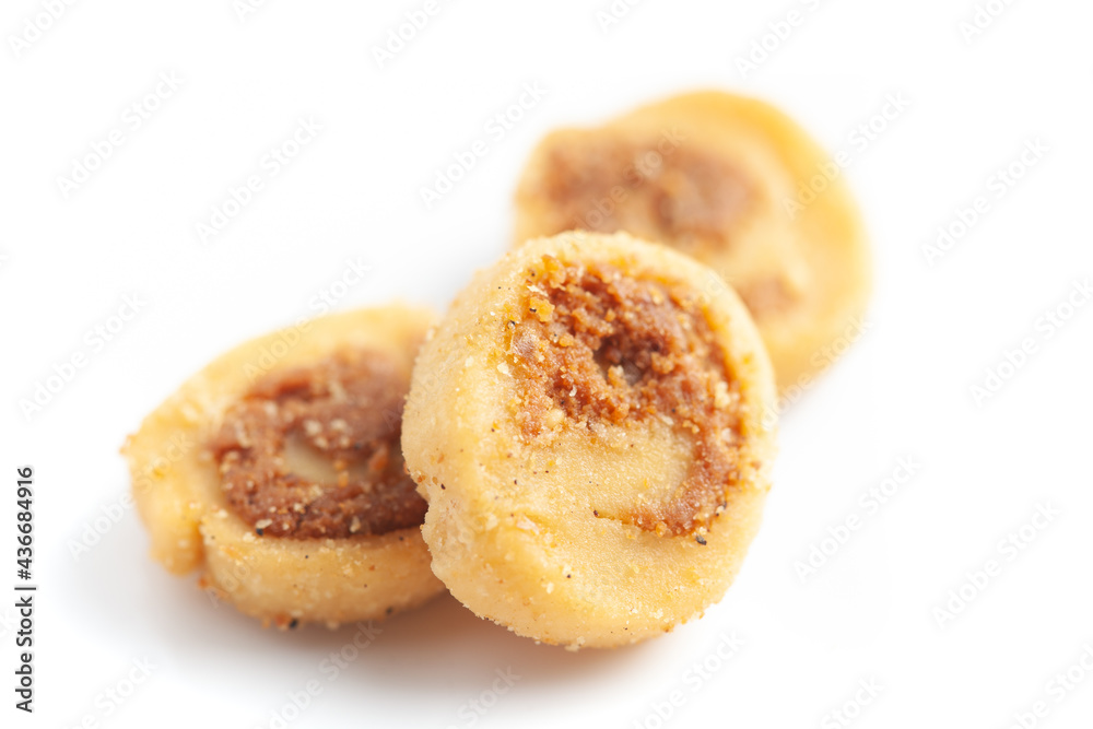 Close-up of freshly baked simple Bhakar Badi traditionally authentic Rajisthani cookies or biscuits. Isolated over studio white background