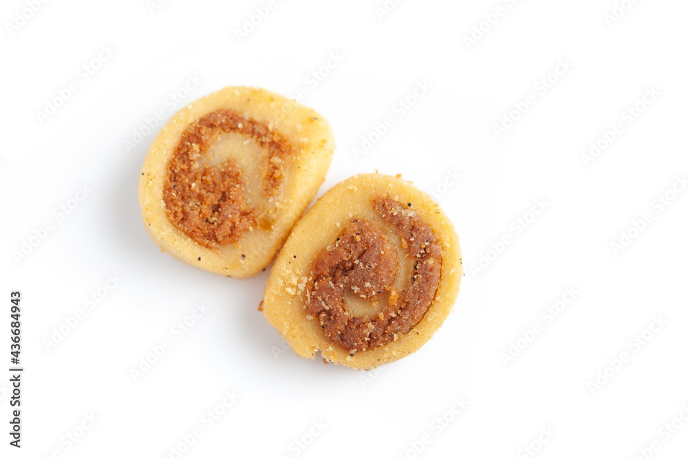 Close-up of freshly baked simple Bhakar Badi traditionally authentic Rajisthani cookies or biscuits. Isolated over studio white background Close-up of freshly baked simple Bhakar Badi traditionally authentic Rajisthani cookies or biscuits. Isolated over studio white background