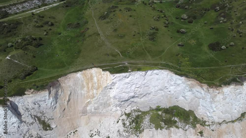 The White Cliffs of Dover, part of the North Downs formation, is the region of English coastline facing the Strait of Dover and France. Kent, England The White Cliffs of Dover, part of the North Downs formation, is the region of English coastline facing the Strait of Dover and France. Kent, England