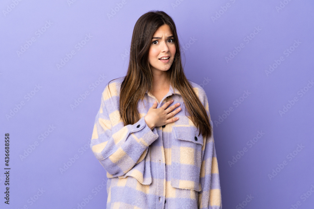 Teenager Brazilian girl over isolated purple background pointing to oneself Teenager Brazilian girl over isolated purple background pointing to oneself